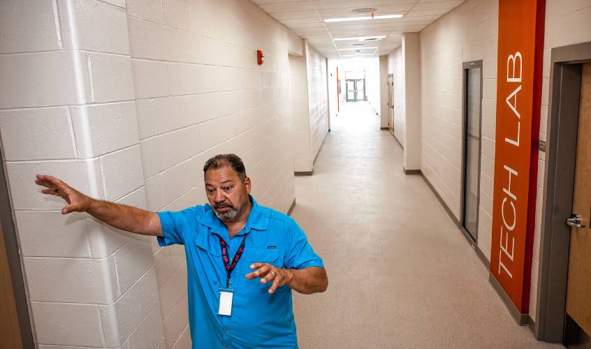 Doug Duffina, the supervisor for plant operations at the Nashua School District, shows off the new Brian S. McCarthy Middle School in Nashua. If Nashua were to build its Brian S. McCarthy Middle School today, the cost would rise to around $115 million. Even with this inflation adjustment, the price would still remain below Concord’s estimated $152 million, an estimate for just one new school.