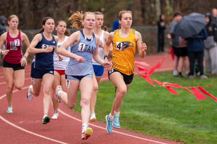 Bow’s Hannah Pawlowski (4) and Nashua North’s Rosalie Neveu (1) lead the pack in the 800 meters at the Black Bear Invitational at Coe-Brown Northwood Academy on Saturday. Pawlowski outkicked Neveu in the final stretch, beating her by .55 seconds to win the 800 title.