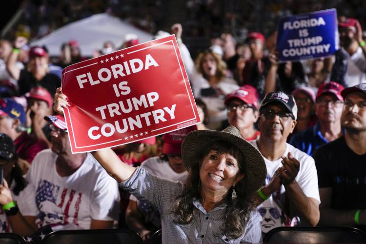 Attendees show their support for former President Donald Trump during a campaign rally in Hialeah, Fla., Wednesday, Nov. 8, 2023. (AP Photo/Lynne Sladky)