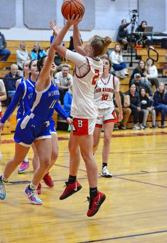 Winnisquam’s Vanessa Power defends against a shot by Belmont’s Darci Stone during a girls' basketball game at Belmont High School on Thursday. Winnisquam won, 63-43. Winnisquam’s Vanessa Power defends against a shot by Belmont’s Darci Stone during a girls' basketball game at Belmont High School on Thursday. Winnisquam won, 63-43.