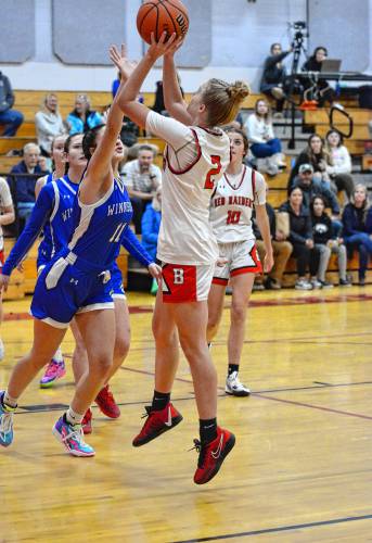 Winnisquam’s Vanessa Power defends against a shot by Belmont’s Darci Stone during a girls' basketball game at Belmont High School on Thursday. Winnisquam won, 63-43.