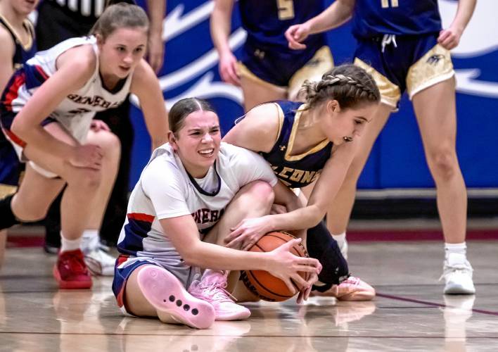 John Stark guard Abby Duclos (center) battles with Bow guard Juliette Tarsa on the floor during the first half on Thursday, January 25, 2024.