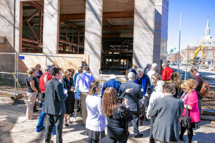 The crowd at the opening of the time capsule at the former DOJ building on Tuesday, April 9, 2024.