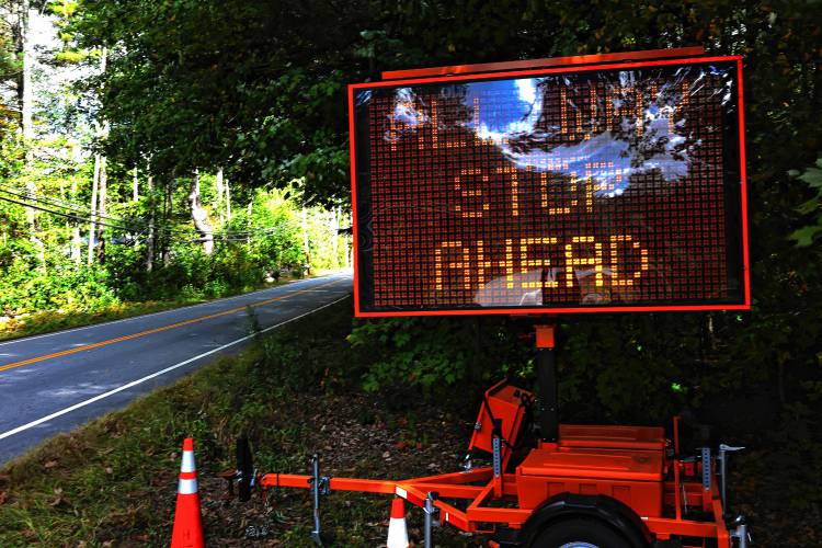 A sign on Mountain Road warns drivers of the new traffic stop at the intersection of Mountain Road and Hoit Road in Concord. 