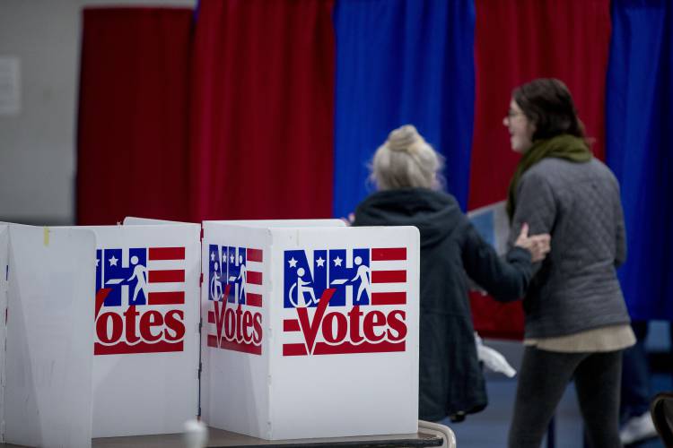 Residents arrive to vote in the New Hampshire primary at Bishop O'Neill Youth Center, Tuesday, Feb. 11, 2020, in Manchester. Residents arrive to vote in the New Hampshire primary at Bishop O'Neill Youth Center, Tuesday, Feb. 11, 2020, in Manchester.
