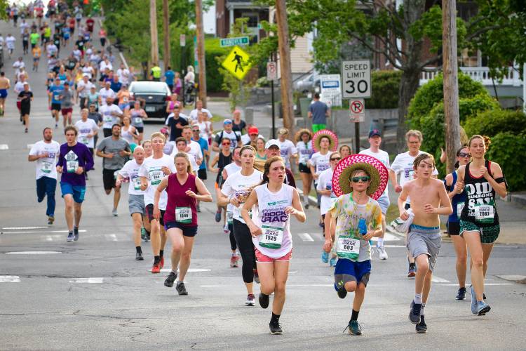 Thousands of runners and walkers take part in the annual Rock 'N Race 5K in downtown Conco. Pictured: Runners on Thursday, May 17, 2018. Thousands of runners and walkers take part in the annual Rock 'N Race 5K in downtown Conco. Pictured: Runners on Thursday, May 17, 2018.