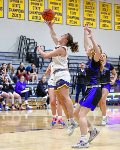 Bow’s Kate Labrecque takes a jump shot against Oyster River during a game at Bow High on Friday. Labrecque scored 13 points to lead the Falcons to a 50-44 victory.