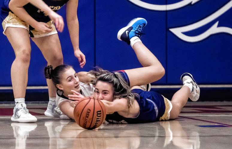 John Stark forward Lexi Korbet battles Bow guard Ella Trefethen (right) for a loose ball during the first half on Thursday, January 25, 2024.