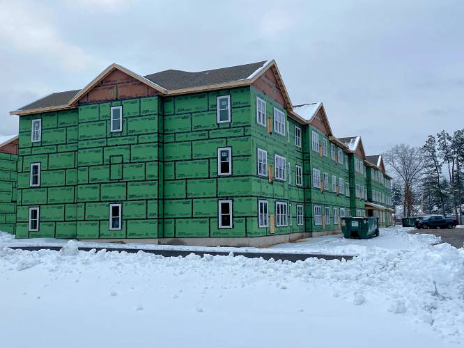 The new apartments at 195, 197, and 199 Pembroke Road in Concord are currently under construction.