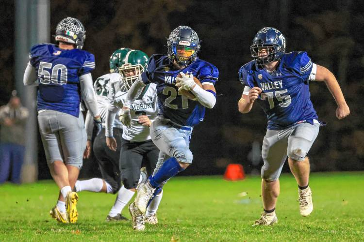 Merrimack Valley’s Reece Clermont (21) runs with the ball for a big gain during the Cloe-O’Brien Trophy game with Pembroke on Friday night.