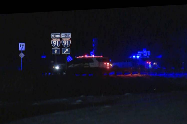 HOLD This image taken from video provided by WCAX shows police cars closing off a road after a shooting involving a U.S. Border Patrol agent on Interstate 91 near Coventry, Vt., Monday, Jan. 20, 2025. (WCAX via AP)