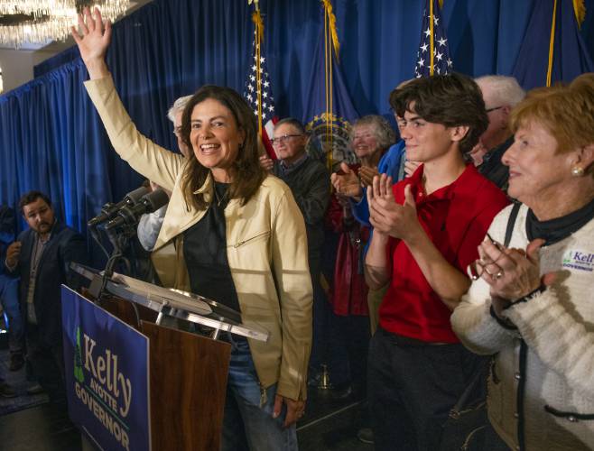 Kelly Ayotte waves to the crowd after winning the governorâs race as her family claps behind her on Tuesday, November 5, 204.