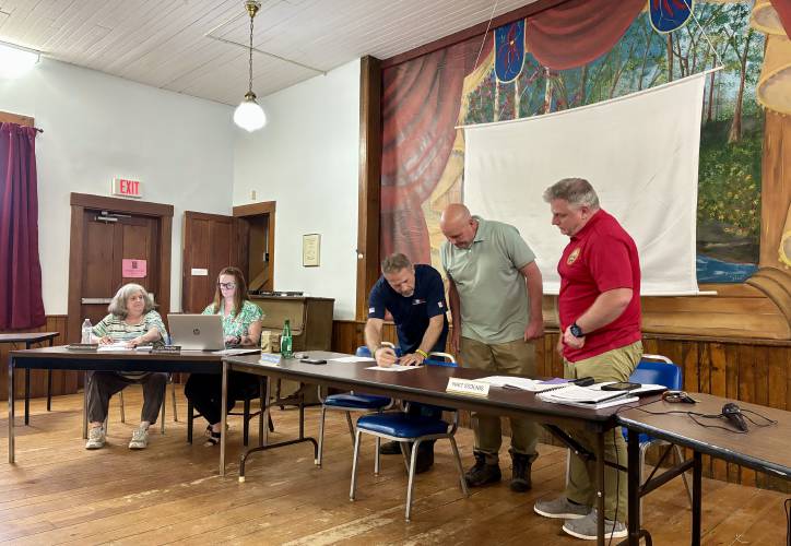 Frank Swirko (second from right) was sworn in as Chichester's newest selectman on Tuesday. He will serve on the Board of Selectmen alongside Richard Bouchard (middle) and Matt Stolnis (right). Frank Swirko (second from right) was sworn in as Chichester's newest selectman on Tuesday. He will serve on the Board of Selectmen alongside Richard Bouchard (middle) and Matt Stolnis (right).