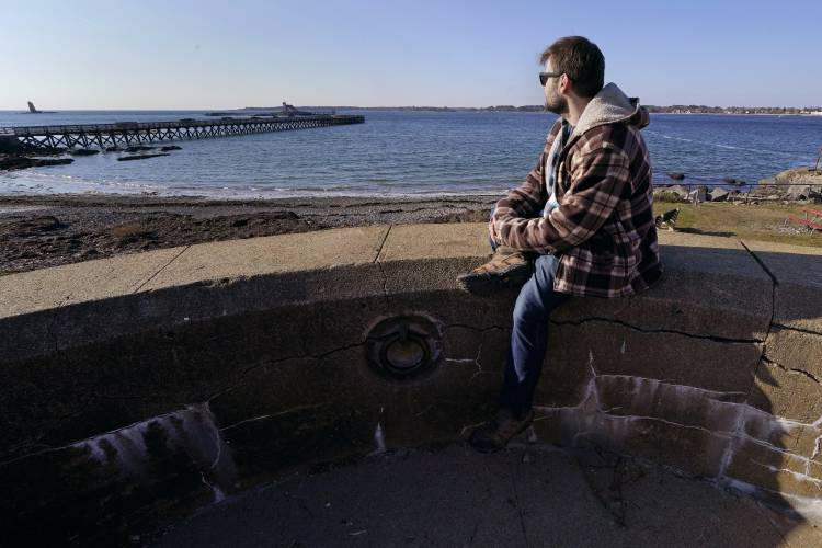 Jacob, an abuse survivor from New Hampshire’s youth detention center, looks out towards the sea at Fort Foster, a place where he finds personal solace, Nov. 30,in Kittery Point, Maine. He says he's frustrated that so few perpetrators have been held accountable. “I am at the point where I want the state to be responsible,” he said.