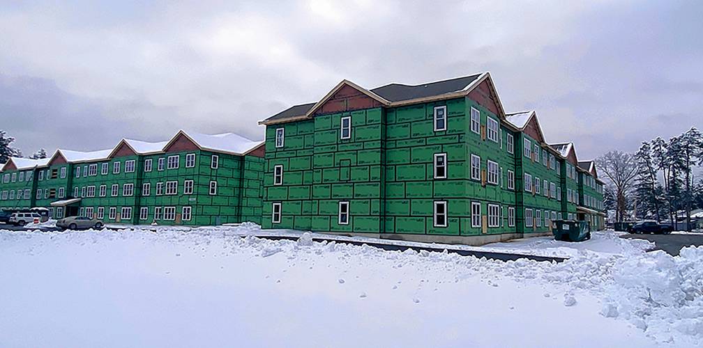 The new apartments at 195, 197, and 199 Pembroke Road in Concord are currently under construction.