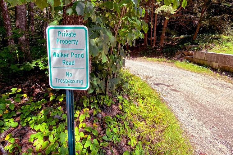 The entrance of Walker Pond Road in Webster where town treasurer Bruce Johnson bought land across from his residence. The entrance of Walker Pond Road in Webster where town treasurer Bruce Johnson bought land across from his residence.