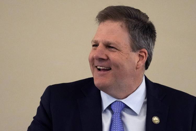 New Hampshire Governor Chris Sununu laughs during his State of the State address at the State House, Thursday, Feb. 15, 2024, in Concord, N.H. (AP Photo/Charles Krupa)