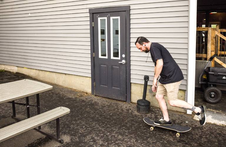 Chris Harrington takes a spin on his skateboard before the rain came at the Feathered Friend Brewery before their market benefit event on Saturday, May 3, 2025. Due to the rain, most of the activities took place indoors.