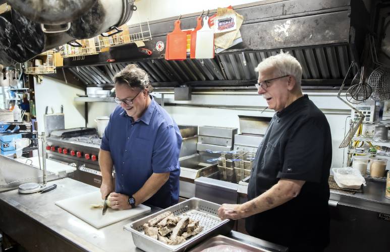 Peter ‘RePete’ Fenton Jr. and Peter ‘Big Pete’ Fenton Sr. in the kitchen of the Appleseed Restaurant in Bradford, which has been a staple in the community for the last 48 years.