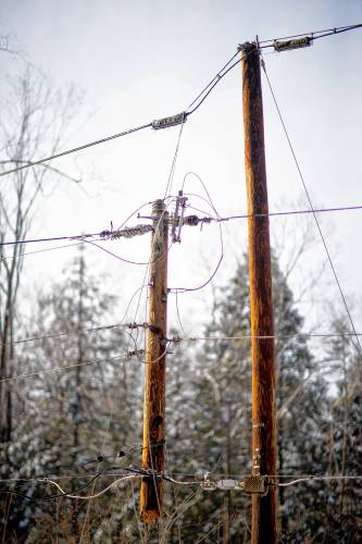 A utlitity pole snapped off from its pole on Old Tilton Road in Canterbury on Monday, March 25, 2024.