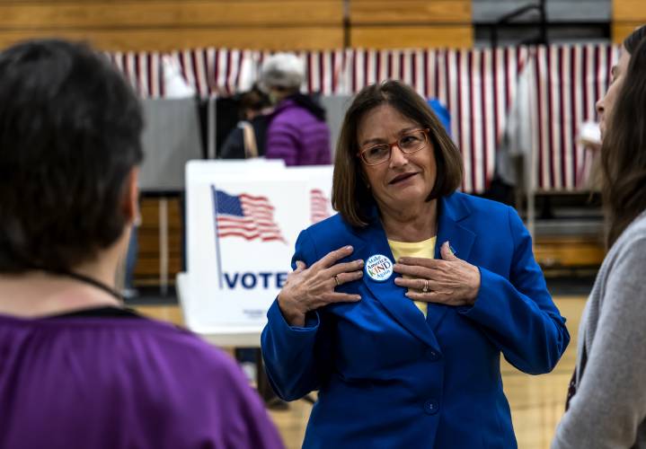 U.S. Rep. Annie Kuster shows her button which says, âMake America Kind Againâ after voting at Hopkinton High School on Tuesday, November 8, 2022.