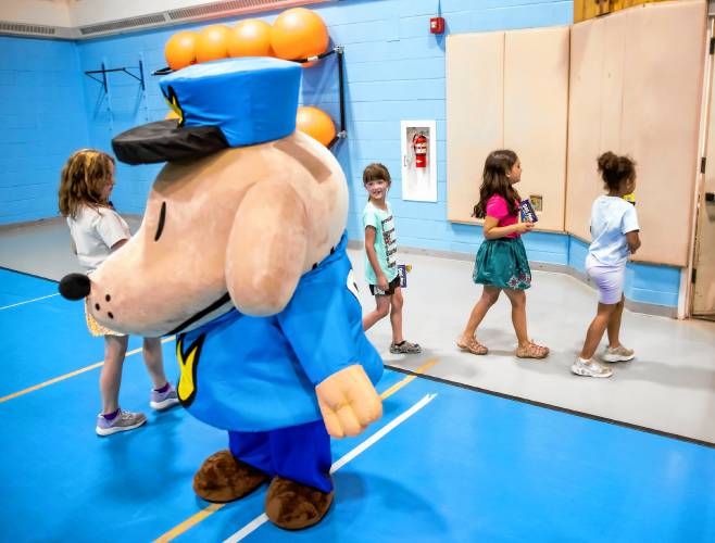 Students say bye to Dog Man after receiving Dav Pilkey’s latest book, Dog Man: the Scarlet Shedder at Beaver Meadow School on Monday, June 10, 2024.