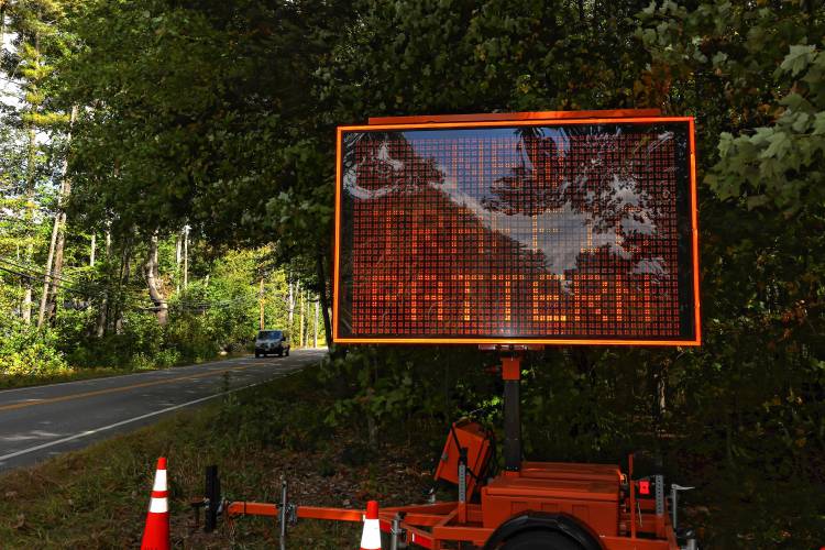 A sign on Mountain Road warns drivers of the new traffic stop at the intersection of Mountain Road and Hoit Road in Concord.