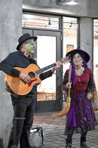 Dave and Susan Bastien performed some spooky Halloween songs during the Halloween Howl in downtown Concord Friday night. 
