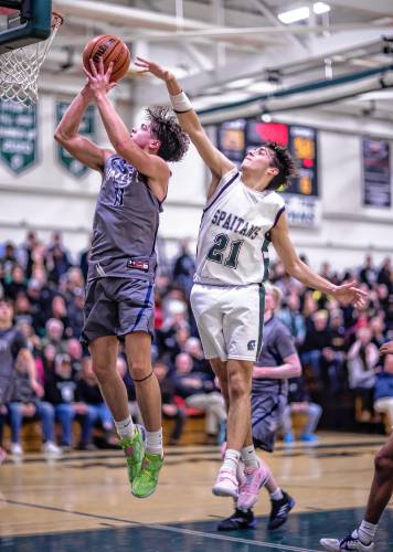Merrimack Valley guard Aiden Gray gets around Pembroke guard Andrew Fitzgerald for a first-half shot.