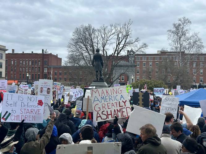 About 2,000 people protest the Trump administration in front of the New Hampshire State House on Saturday, April 5.