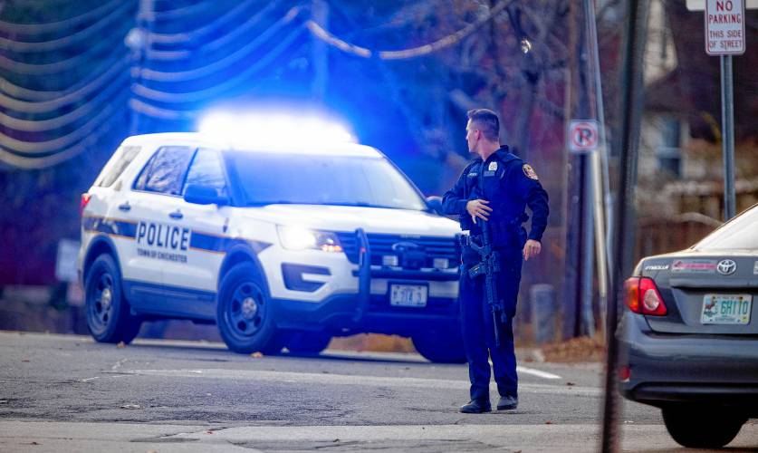 A police officer stands on Clinton Street after a shooting at the New Hampshire Hospital on Friday afternoon, November 17, 2023.