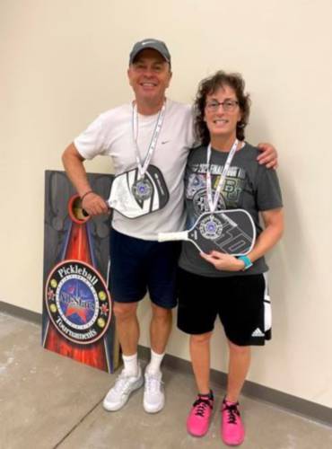 Nancy Morton of Sandwich, right, plays pickleball at Gilford Hills Tennis & Fitness Club each week. She is battling Lyme disease after being diagnosed in 2012. She and her partner, Adam Heard of Sandwich, left, won the silver medal in mixed doubles in an October tournament at All-Stars Pickleball club in Concord. Her self-esteem and love for the game skyrocketed that day, she said.