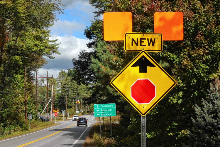 A sign on Mountain Road warns drivers of the new traffic stop at the intersection of Mountain Road and Hoit Road in Concord. The intersection was the scene of many accidents over the years.