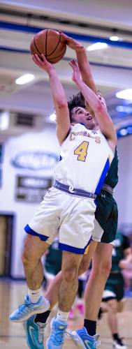 Kearsarge guard Austin Needham drives to the basket against Hopkinton on Tuesday night.
