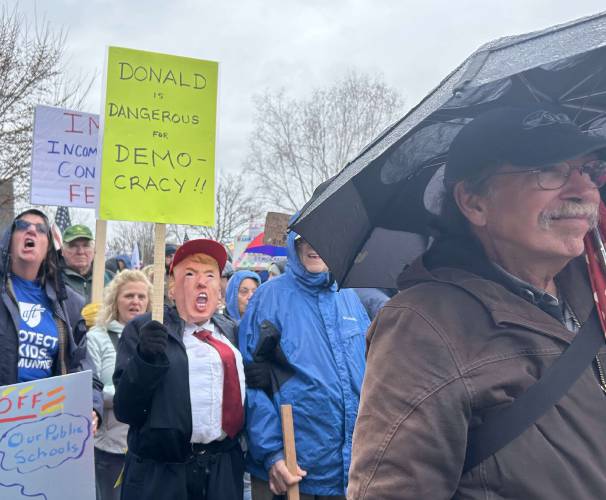 About 2,000 people protest the Trump administration in front of the New Hampshire State House on Saturday, April 5.