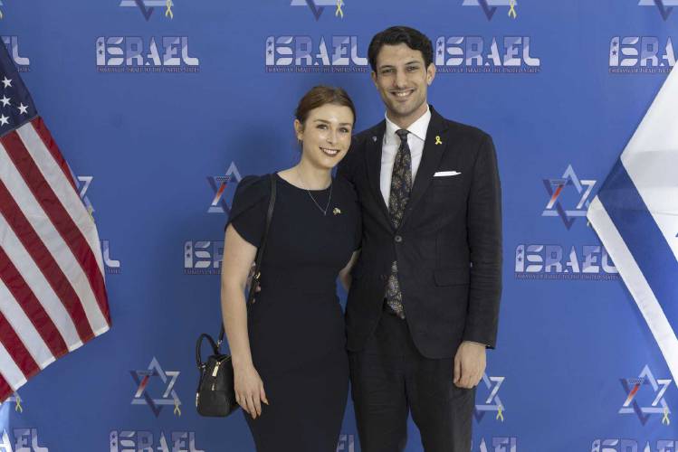 This undated handout photo provided by the embassy of Israel in the U.S. shows staff members of the Israeli Embassy in Washington, Israeli citizen Yaron Lischinsky, right, and U.S. citizen Sarah Milgrim. (Embassy of Israel in the U.S. via AP)