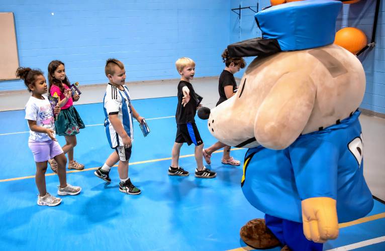 Students say bye to Dog Man after receiving Dav Pilkey’s latest book, Dog Man: the Scarlet Shedder at Beaver Meadow School on Monday, June 10, 2024.