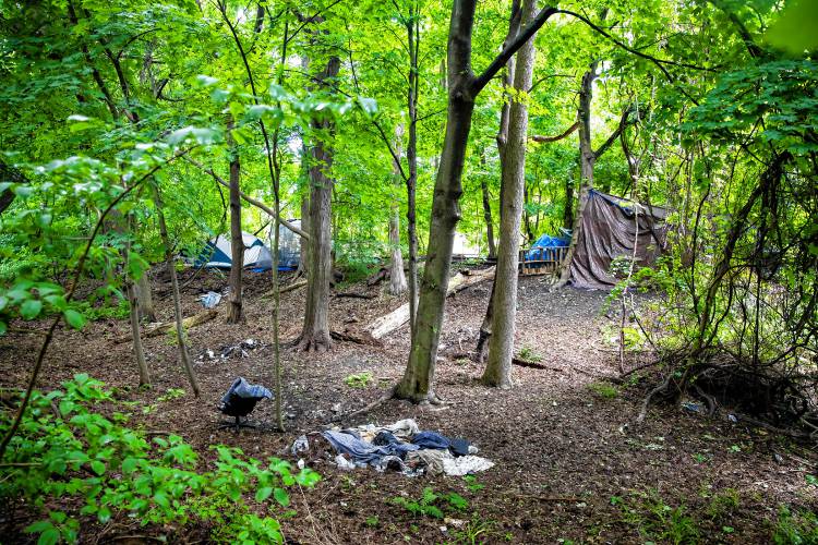 LEFT: One of the two homeless camps behind the home of Robin Bach’s neighbor. The other camp is behind Bach’s backyard.