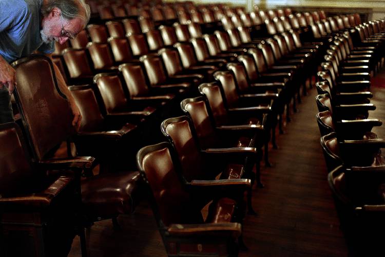 Stuart Russell, of Concord, works on replacing several seat backings during the 23rd Annual Pitch-in at the Concord City Auditorium on August 21, 2013. Stuart Russell, of Concord, works on replacing several seat backings during the 23rd Annual Pitch-in at the Concord City Auditorium on August 21, 2013.