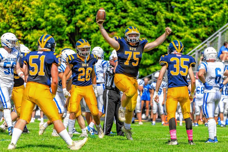 Bow lineman Dale Berg (75) comes up with the ball after recovering a fumble during Bow football's season opener at home against Pelham on Saturday. Berg recovered two fumbles, but Pelham won the game 34-13.