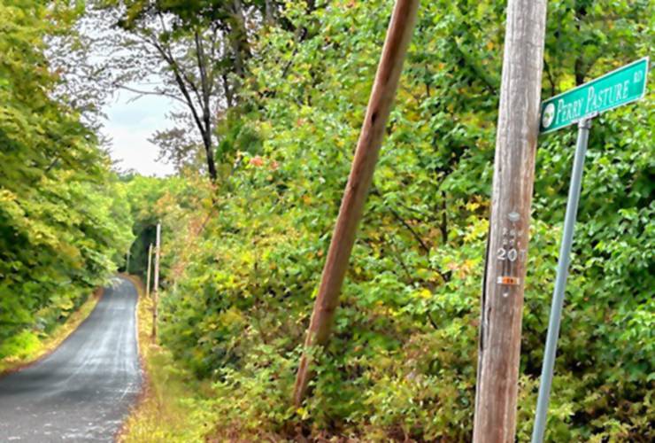 A cross and memorial have been placed at the site of a crash on Perry Pasture Road in Dublin, where a crash on Friday afternoon resulted in the death of Damien Cronan, 17, of Antrim, and the injury of two other teens.