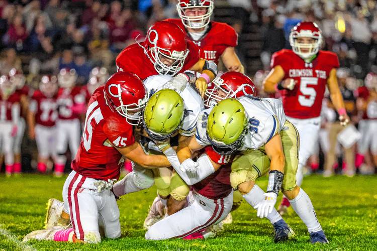 Concord’s defense swarms a Windham player in during a game on Friday night. The Tide’s defense was outstanding in a 20-7 victory.