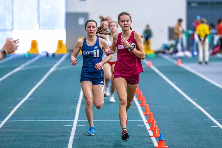 Concord’s Shelly Smith leads Exeter’s Alexis Paterna in the 3,000 meters at the NHIAA Division I indoor track and field championships on Saturday at Plymouth State University. Smith led for 14 of 15 laps, finishing second to Paterna in the 3,000, and ran the 1,500, coming in fourth, to help lead Concord to second as a team.