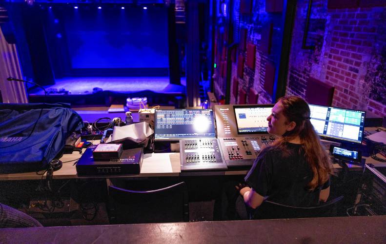 Erin works the lighting board at the New Hamphsire Stage on Janurary 31, 2025.