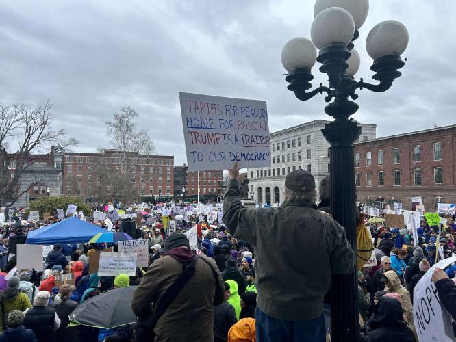 About 2,000 people protest the Trump administration in front of the New Hampshire State House on Saturday, April 5.