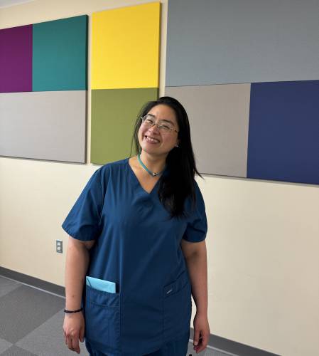 Yuhsien Wu-Riggs smiles for a photo before her graduation from Second Start’s first cohort of the LNA program for New Americans. 