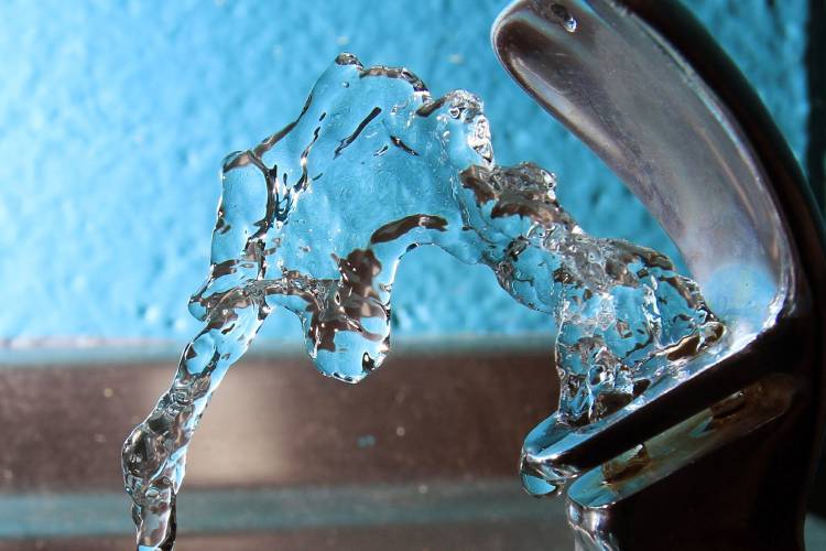 FILE - In this Friday Jan. 7, 2011, file photo, water flows from a water fountain at the Boys and Girls Club in Concord.