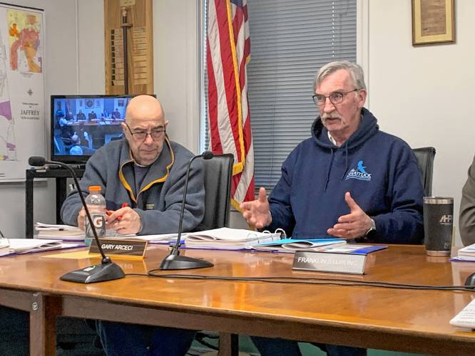 Planning Board member Gary Arceci and Select Board ex-officio Franklin Sterling ask questions during a presentation of a plan to build a community-owned solar field on Jaffrey town land.
