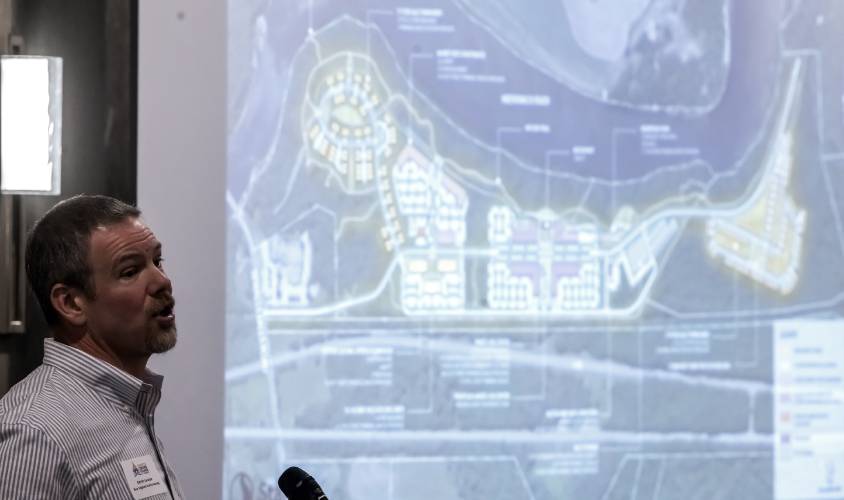 Kevin Lacasse, C.E.O of New England Family Housing, shows the plans for the Monitor Way project at the Greater Concord Chamber of Commerce luncheon on Thursday, January 11, 2024.