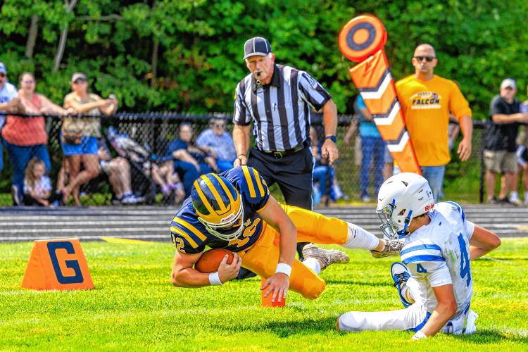 Bow quarterback Brady Lover dives into the end zone for a touchdown during Bow football's season opener at home against Pelham on Saturday. Lover scored both of Bow’s touchdowns.